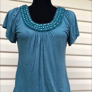 Ladies top with scoop neck “bling”. Sz M